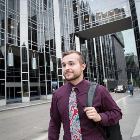 A student walks through PPG Place in the city of Pittsburgh near Market Square October 21, 2019 during the Creosote Affects photo shoot at Washington & Jefferson College.