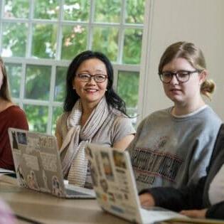 Associate Professor of the English Tara Robbins Fee, Ph.D., works with students.